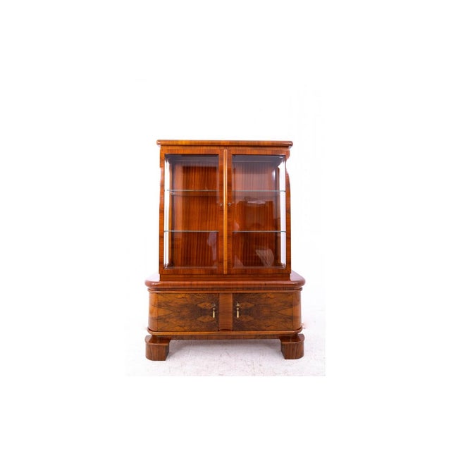 Exceptional Art Deco display cabinet, Poland, circa 1930. Very good condition; professionally restored and finished with a...