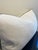 This lumbar pillow features a crisp, white textured fabric that adds a touch of sophisticated comfort to any seating area....