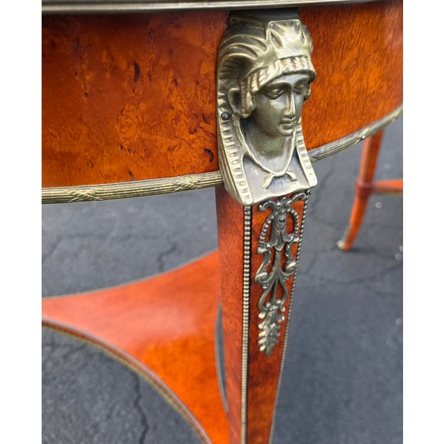An exceptionally refined pair of Neoclassical-inspired occasional tables by the esteemed John Widdicomb Company, Grand...