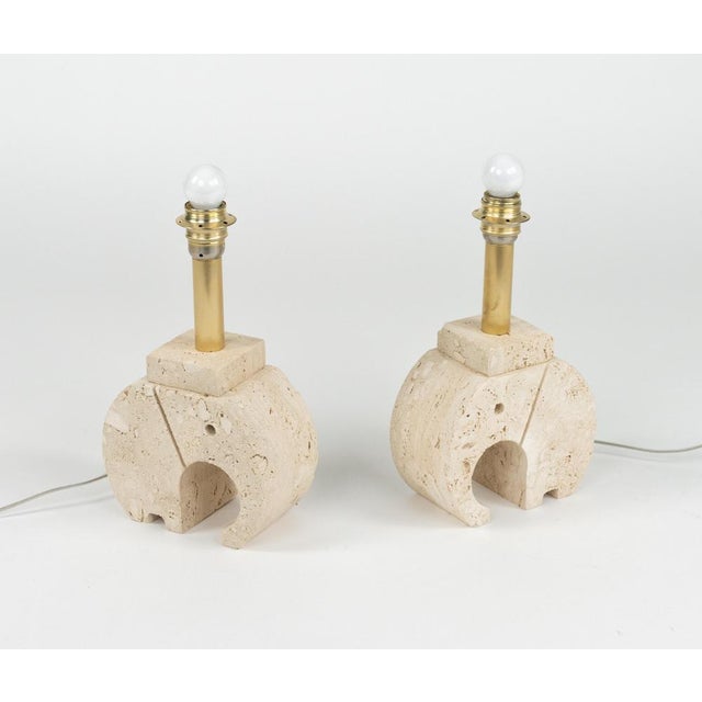 Midcentury amazing pair of sculpture table lamps in travertine and brass shape of a elephant by Fratelli Mannelli. Made in...