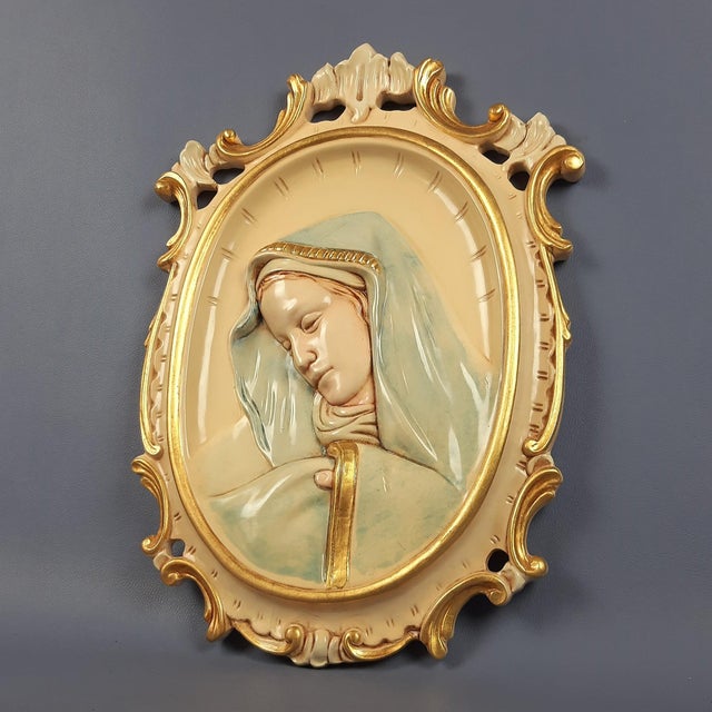 Wonderful vintage sacred high-relief icon depicting the Madonna, handcrafted from carved, lacquered, and hand-painted wood...