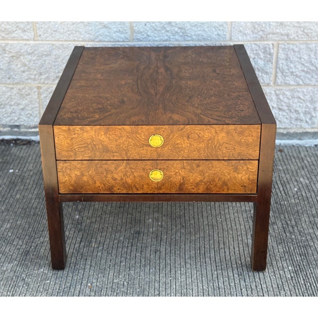 Mid-century nightstand by Century Furniture with a clean, rectilinear form. Burl wood veneer to the top and drawer fronts,...
