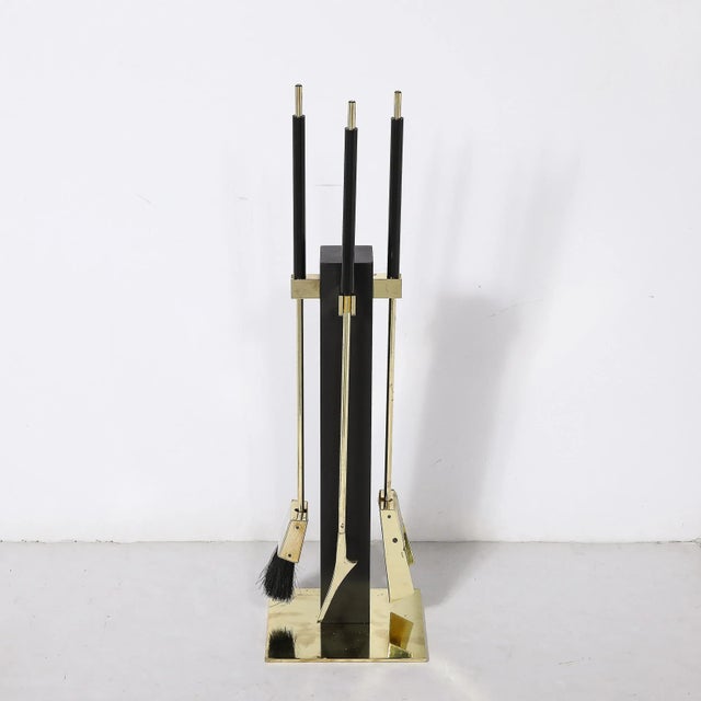 This sleek and sophisticated Mid-Century Modernist Three Piece Fire Tool Set in Polished Brass and Black Enamel by...