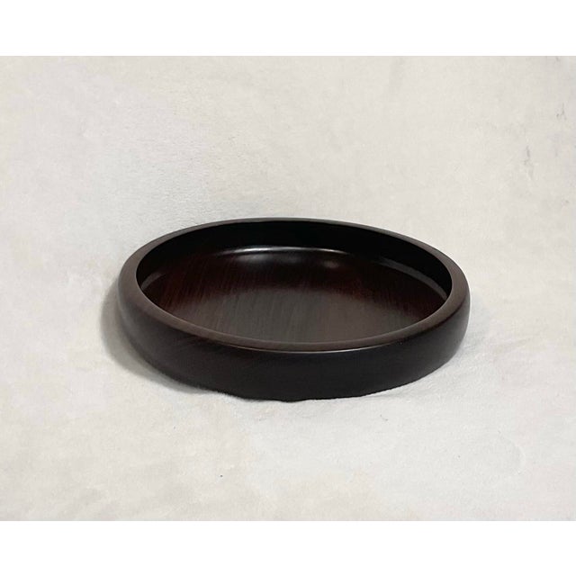 Modern Brazilian solid Rosewood, hand turned round wooden bowl, circa 1960’s. Features a modern and simple design. In...