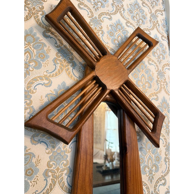 A charming mid-century wood wall décor piece shaped like a spinning windmill, complete with a slatted rotor, mirrored...