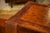 A coffee table with a simple and elegant design, entirely covered in leather with a warm patina.