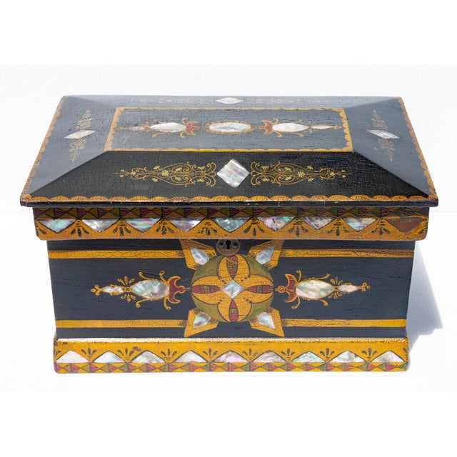 Sophisticated American folk art box. Wood painted and inlaid with mother of pearl. 19th century.