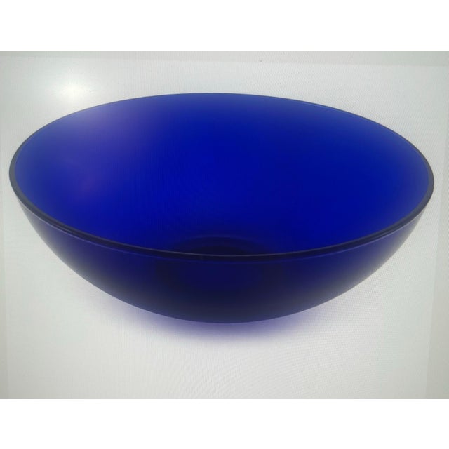 Striking vintage cobalt-blue art glass bowl featuring a clean, gracefully rounded form and rich saturated color. The deep...