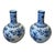 Bring timeless elegance and classic Chinoiserie style to your home with this striking pair of vintage blue and white...