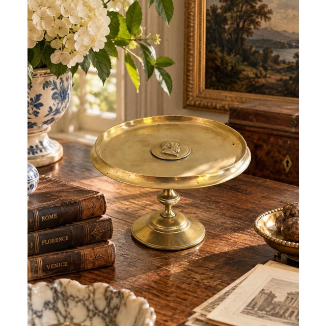 An elegant 19th-century Italian Grand Tour brass tazza, distinguished by its classical proportions and central portrait...