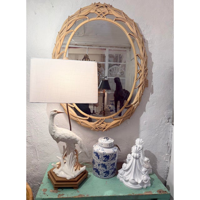 Stunning, timeless Palm Beach Regency-style mirror in the manner of Serge Roche. Made by Carolina Mirror Co. It features a...