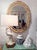 Stunning, timeless Palm Beach Regency-style mirror in the manner of Serge Roche. Made by Carolina Mirror Co. It features a...