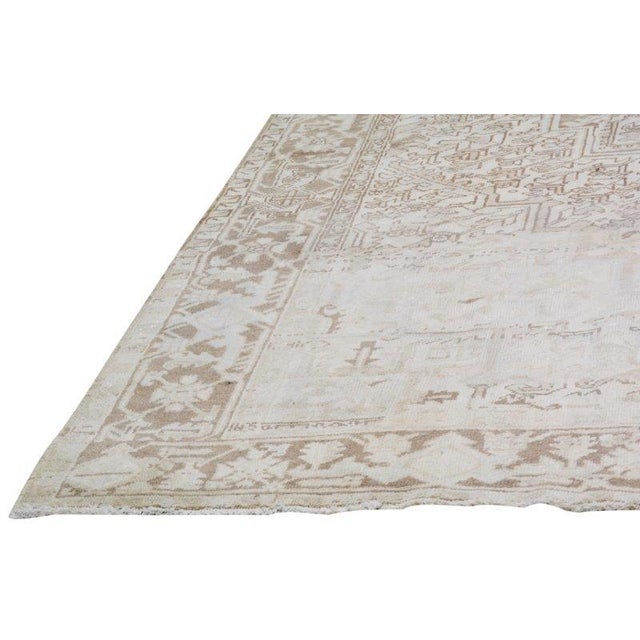 Hand-knotted with care using traditional rug-making techniques, this wool rug blends timeless craftsmanship with a modern...