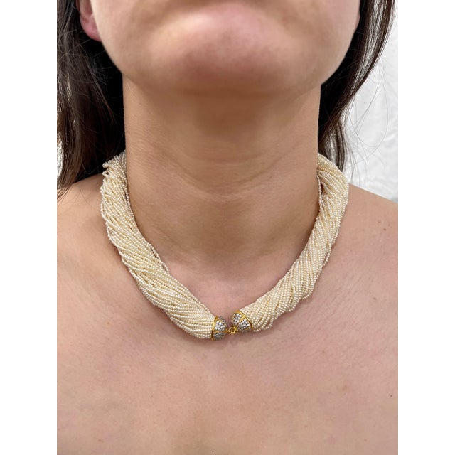 Stunning Necklace composed of 43 strands of seed pearls ( average 2mm in size ,well matched, of cream body color with...