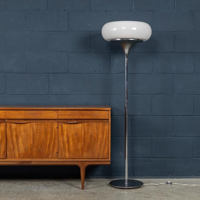 A striking vintage floor lamp designed by guzzini for guzzini, italy, dating to the 1970s. This iconic piece showcases the...