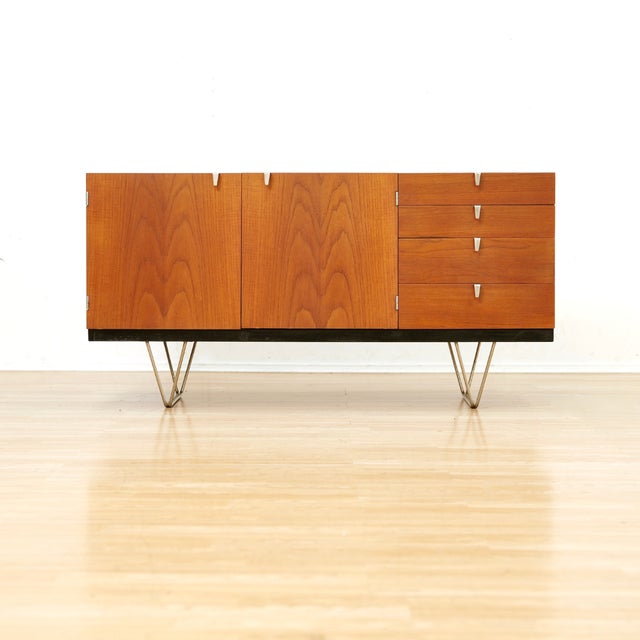 This vintage mid-century credenza was produced by Stag Furniture during the 1960s. An elegant design and produced in rich...