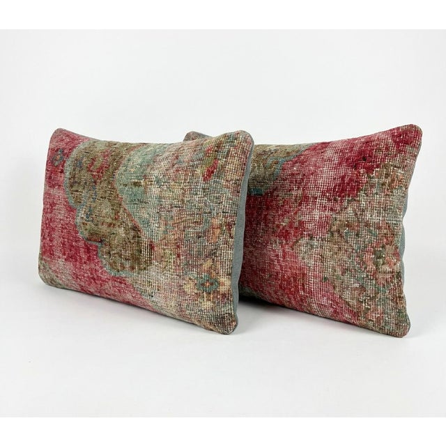 This beautiful 16'' x 24'' pillow cover set was made from authentic Turkish rug pieces. Bright colors of wool adorn the...