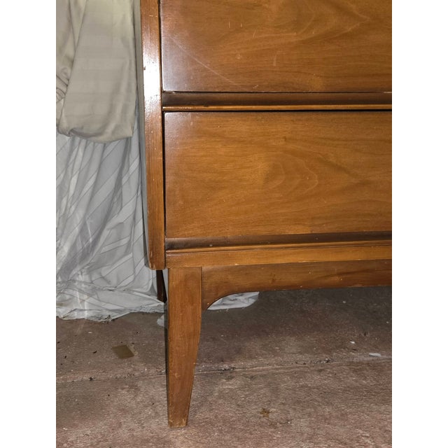 Mid-Century Modern walnut 9-drawer dresser attributed to Dixie Furniture. My parents purchased this piece in 1966 along...