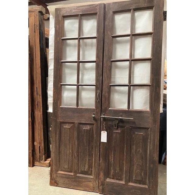 These frameless doors are a unique one-of-a-kind piece. It comes as a double door. Details include raised panels and 16...