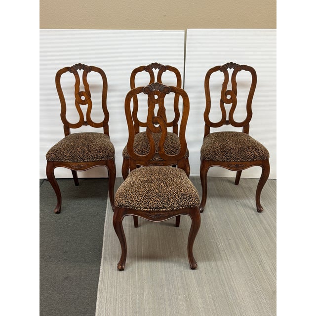 Design Plus Gallery presents a Set of Four Leopard Printed Dining Chairs with French Provincial Frames. The style of...