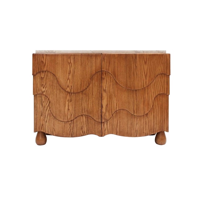 Elegant pair of contemporary sideboards handcrafted from solid oak wood, featuring a sophisticated travertine top. Each...