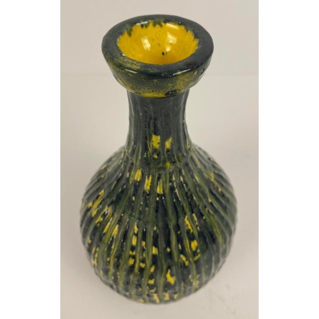 Italian mid-century glass vase, stunning green and yellow glass vase. This handcrafted glass vase is small in scale, yet,...