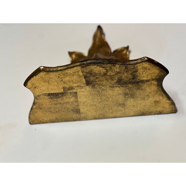 Ornate gilded wood wall bracket with cascading leaf motif. Exceptional.