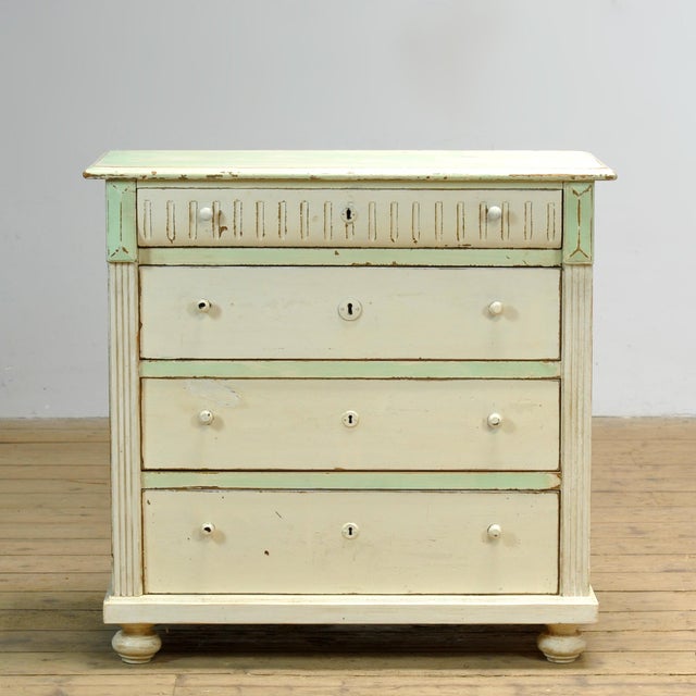 This chest of drawers, manufactured around 1910 in Hungary, is a piece of furniture with character and history. The...