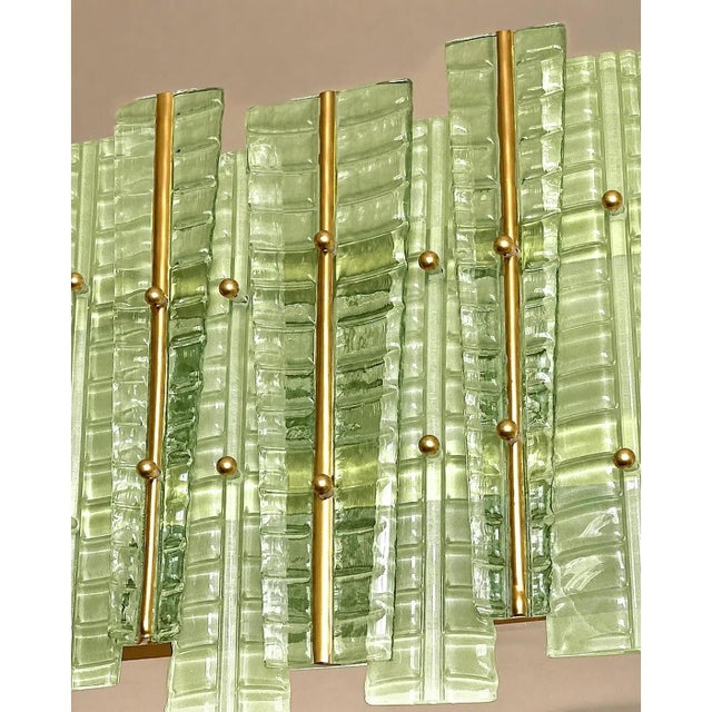 Contemporary gold chandelier in Murano Glass full of leaves that give a touch of “tropical” design. Extremally elegant and...