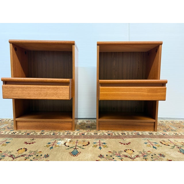Design Pus Gallery presents a Pair of Mid 20th Century Teak Wood Nightstands. The two bedside tables have a Danish design...