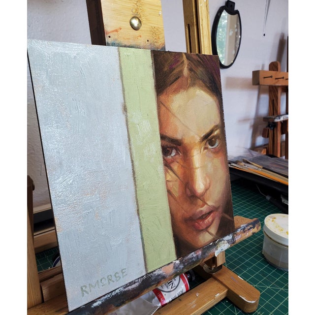 This oil painting captures a moment of introspection, depicting a young woman's face partially obscured by a vertical...