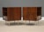 A pair of mid century modern rosewood thin edge nightstands designed by George Nelson for Herman Miller with a single...