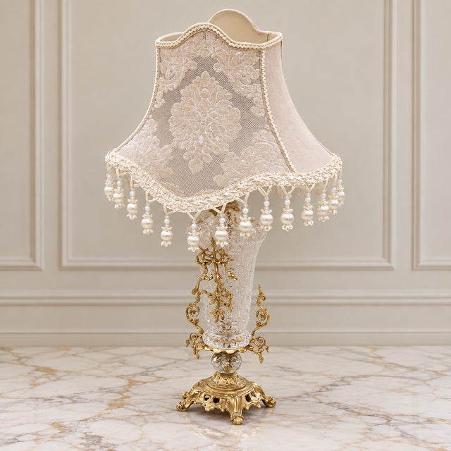 Exquisite French-style crystal table lamp featuring a uniquely shaped romantic silhouette adorned with elegant hanging...
