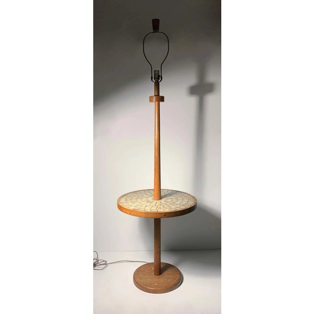 Gordon Martz floor lamp Measures: 60" height to top of wood finial. 19.75 height to top of table.