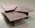 A beautiful set of three vintage nesting tables in pink granite from the 1970s. We love their geometric lines, softened...