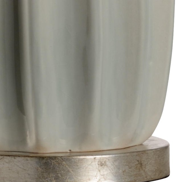 Fluted sage green glazed ceramic with antique silver leaf accents 29h x 6w x 6d Shade Dimensions: top(14) bottom(16) side(11)