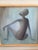 A vintage French oil painting on canvas depicting a seated abstract figure, signed Rousseau. The composition is simple and...