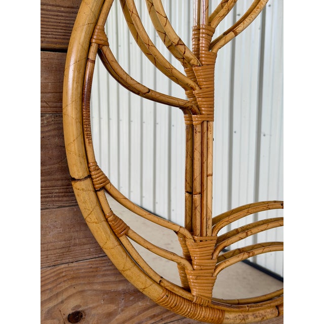 A striking Italian rattan and bamboo wall mirror dating to the 1960s–1970s and bearing its original Raymor label. The...