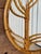 A striking Italian rattan and bamboo wall mirror dating to the 1960s–1970s and bearing its original Raymor label. The...