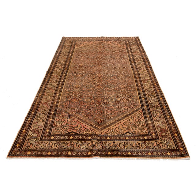 This exceptional antique Persian Malayer rug is crafted from hand-knotted wool. The design features a beautiful...
