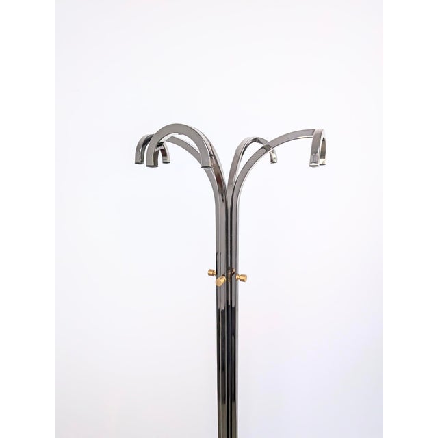 This coat rack embodies the elegance of 1970s Italian design. The travertine base displays beautiful variations in color,...