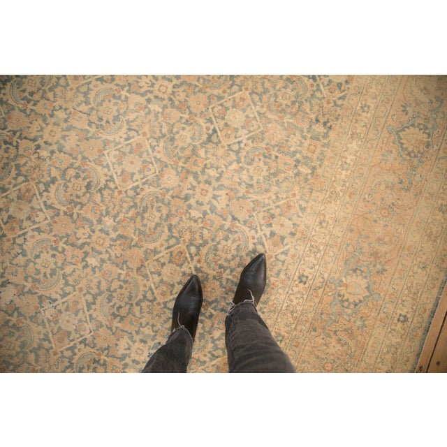 :: Allover covered field in a repeating Herati design motif wrapped by multiple minor borders of meandering vine and...