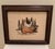 Charming vintage circa 1970s cross-stitch depicting a white and black chicken nestled in a woven basket, worked in a warm,...