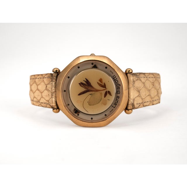Vintage women's wristwatch by Laura Biagiotti (1990s), featuring Italian design and a Swiss quartz movement. The key...