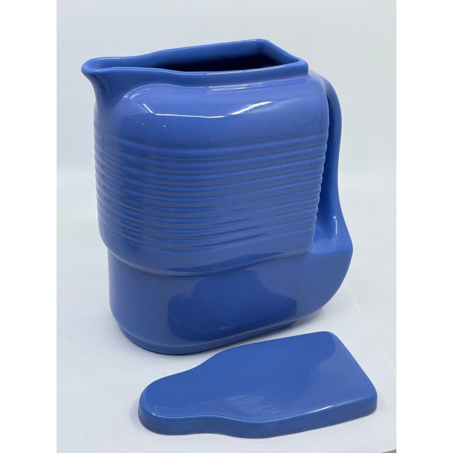 Beautiful 1930’s milk container with lid. The blue color ceramic milk container is perfect for the refridgerator. Made by...