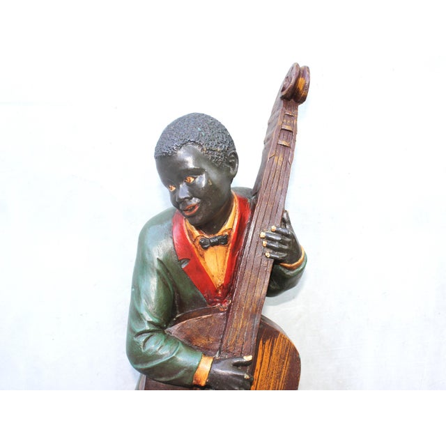 An impressive figure of jazz musician double bass player. Big, noticeable, attention grabbing. It is so vintage, so jazz,...