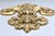 A substantial gilt scroll and fleur-de-lis wall piece, cast in resin with the deep relief and layered acanthus detail of a...