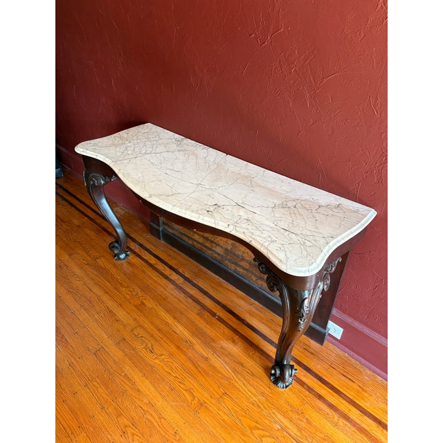 Beautiful 19th c marble top console table with an original aged mirror bottom. The marble has been professionally repaired...