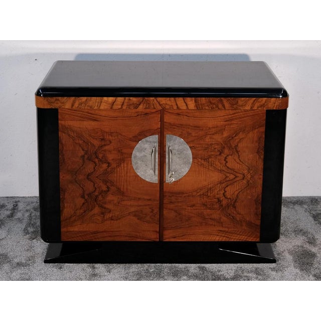 Small Art Deco Sideboard in Walnut with Black High-Gloss Lacquer Accents, 1930s, in Restored conditions. Designed 1920 to...