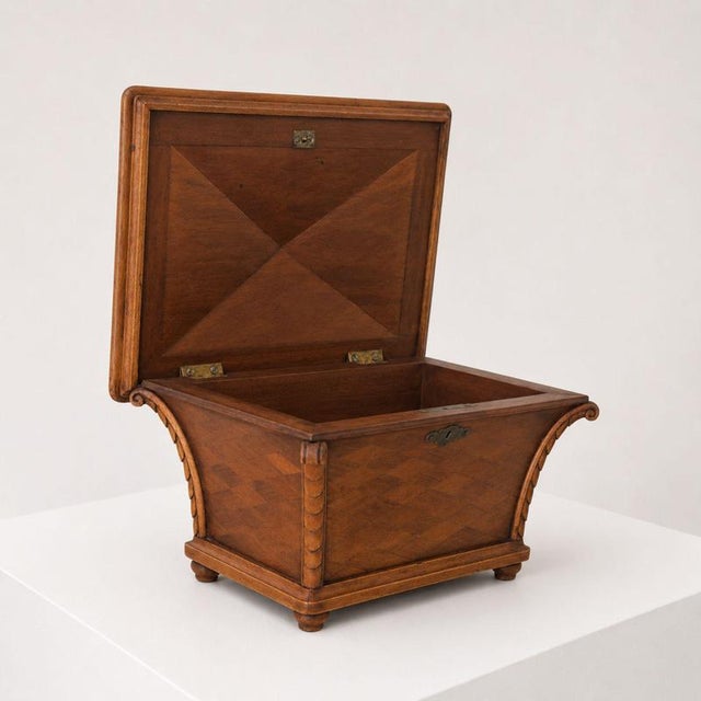 Elegant decorative wooden box/tea caddy in Mid-Century Modern style, with sculpted details and brass inserts. The shape...